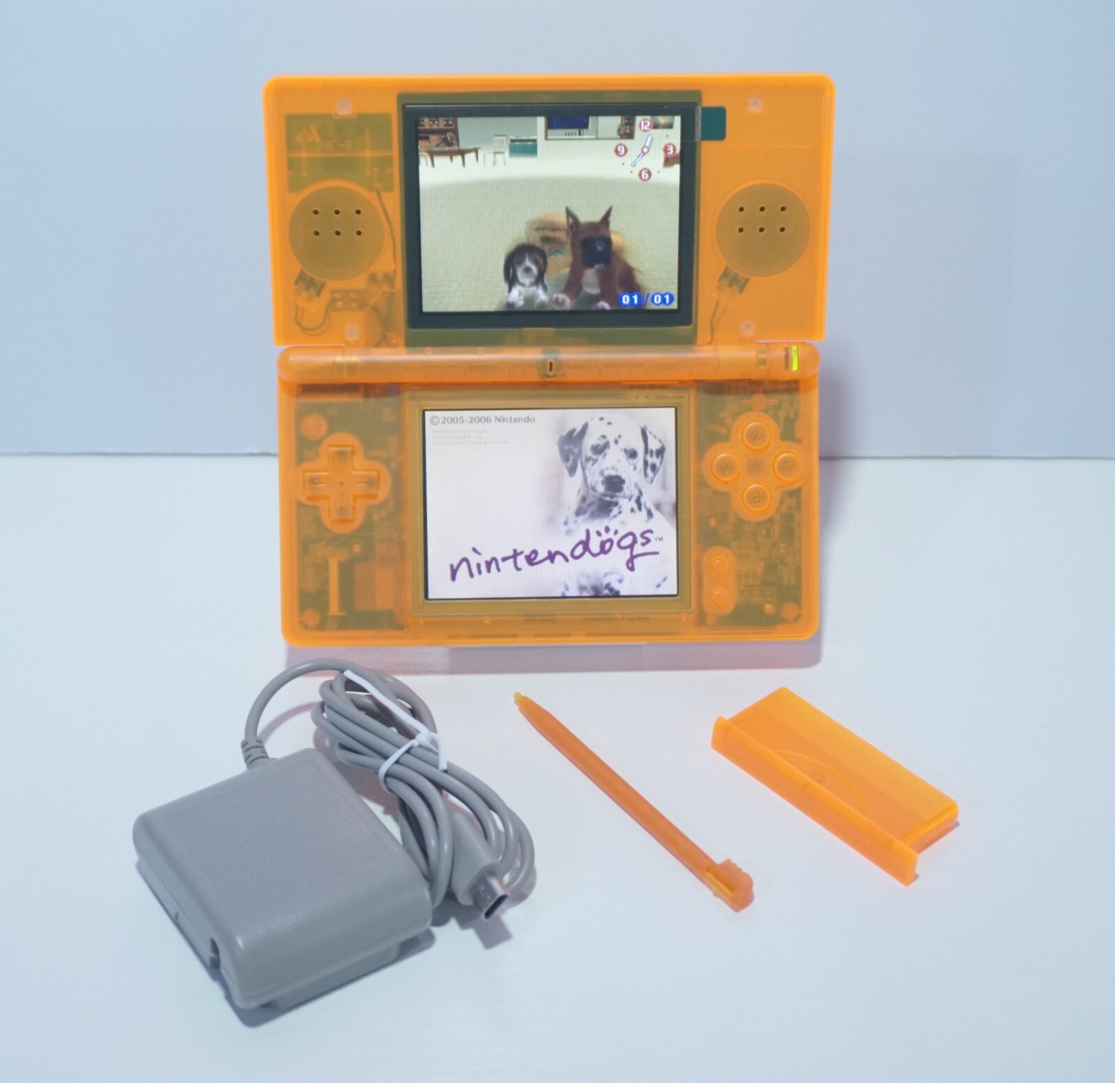 Nintendo DS Lite Transparent Clear Orange Handheld System with Charger & Stylus