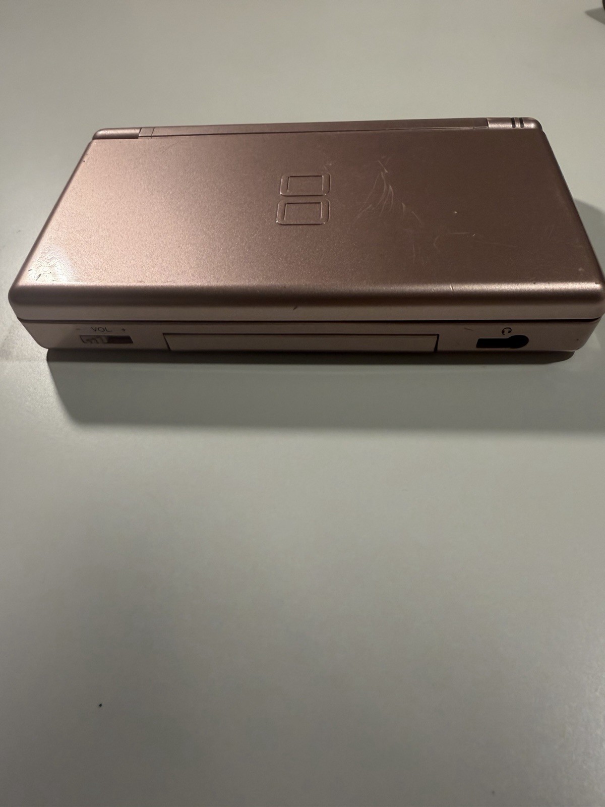 Nintendo DS Lite Metallic Rose System With Charger, Original Box, And 2 Cases