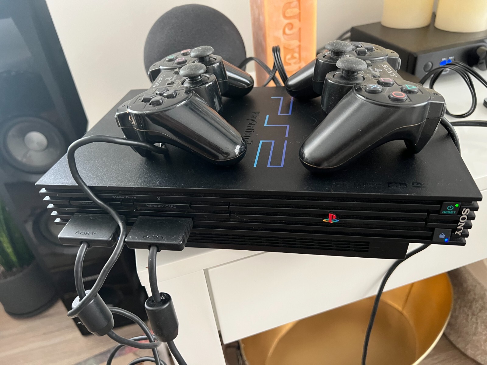 PlayStation 2 console bundle (2 controllers, 2 games, & 3 8mb memory cards)