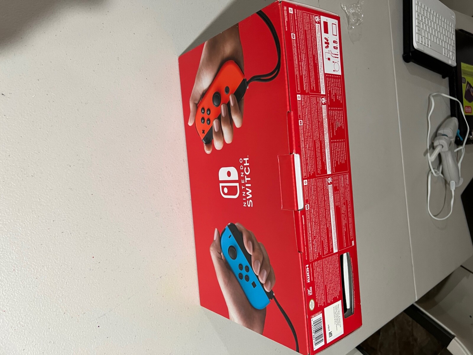 Nintendo Switch with Blue and Red Joy-Con Controllers and Mario Kart 8 Bundle –