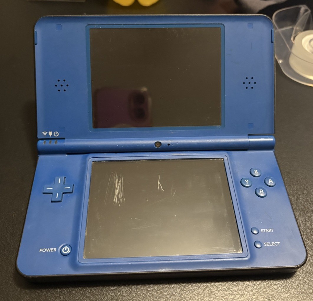 Nintendo DSi XL Midnight w/ USB charger, includes 2 Games, no stylus