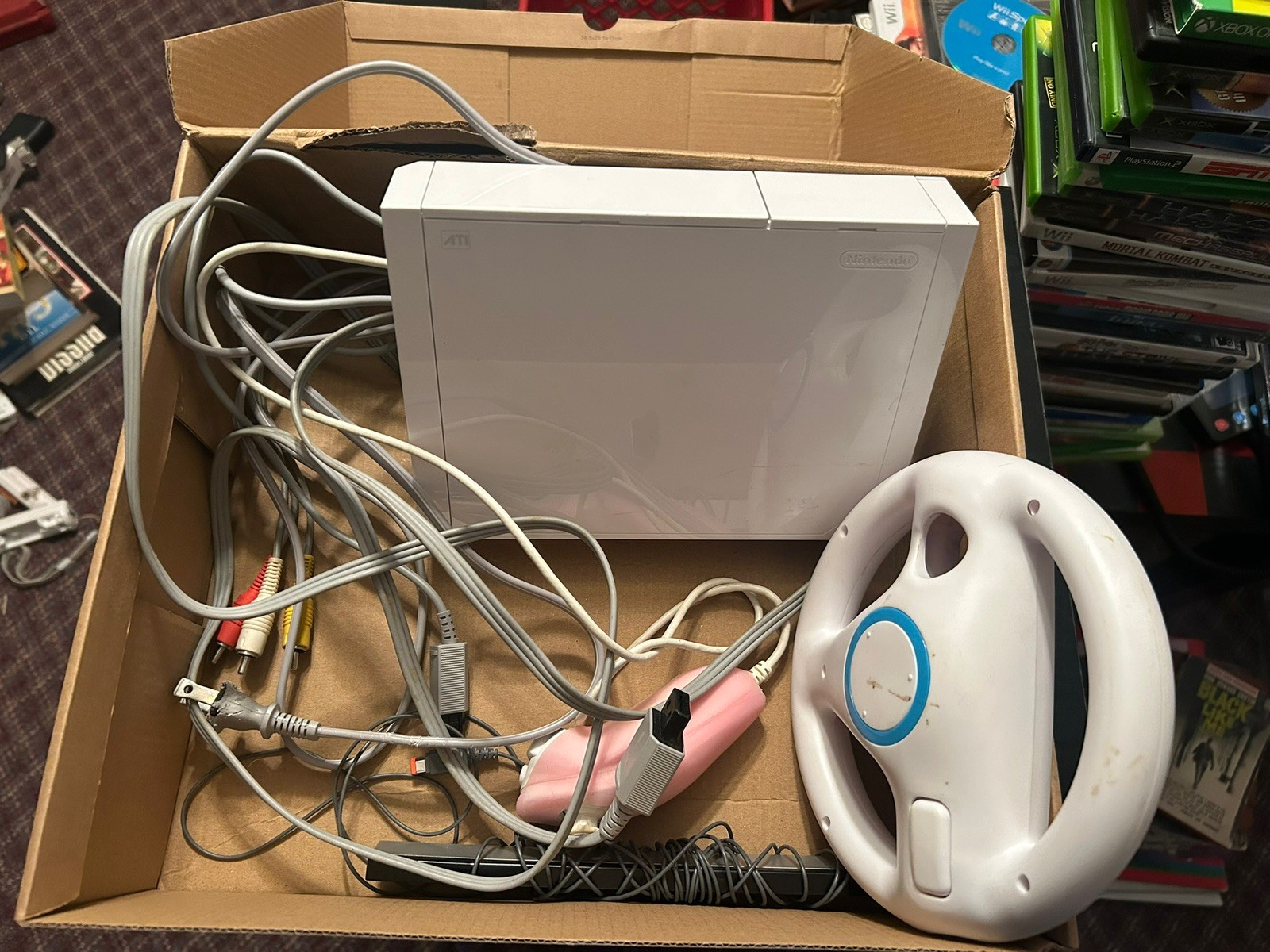 Nintendo Wii Tested And Working. Includes cables and everything pictured.
