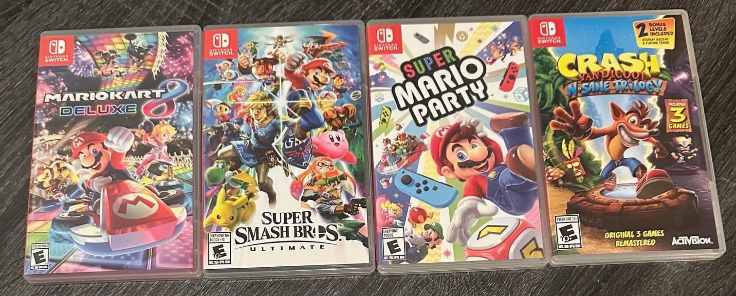 Nintendo Switch US w/ Blue & Red Joy-Con + Mario Kart + Games + Pro Controller