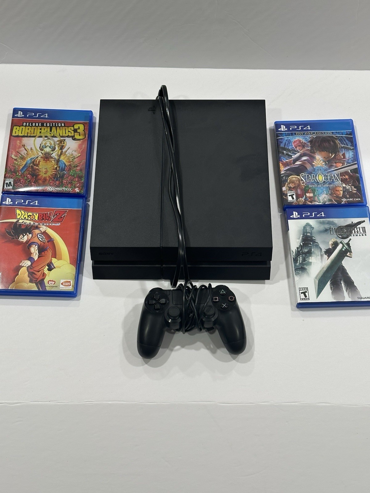 Playstation Four Lot ( PS4 Factory Reset & 4 Games Included) with controller