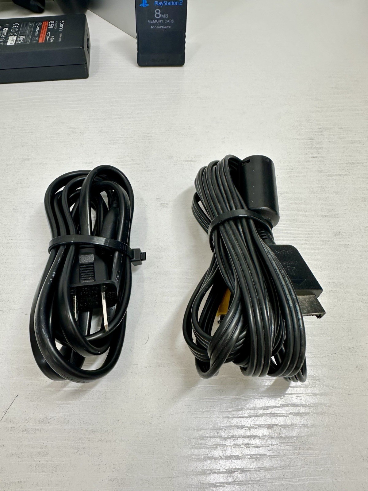 Silver PlayStation 2 Slim OEM Bundle – OEM Controller, OEM Cables, Memory Card