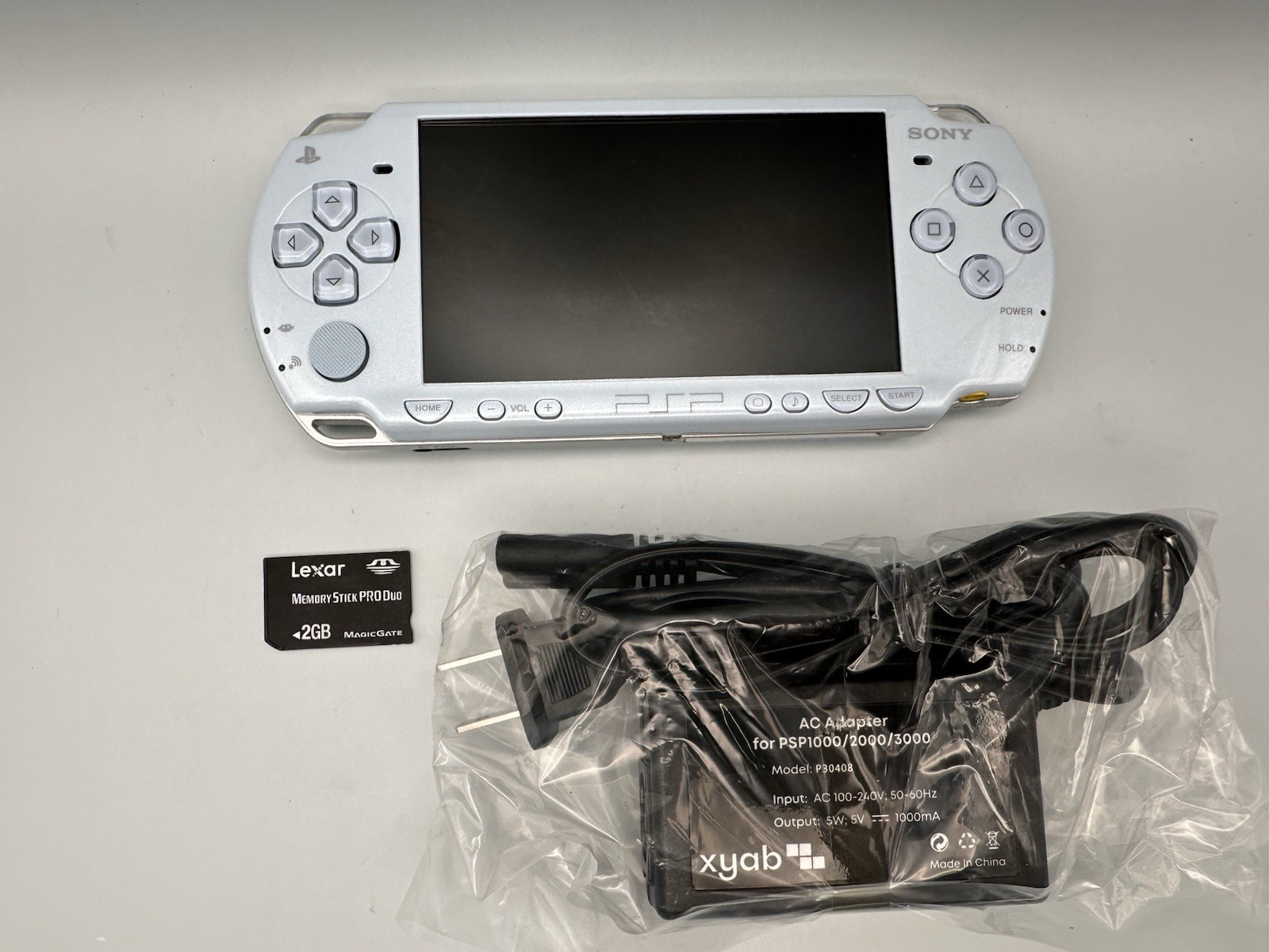 Sony PSP 2000 Console – Felicia Blue + New Battery + 2GB Memory Stick + Charger