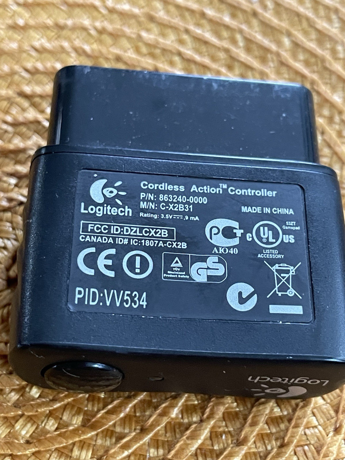 A Logitech PID VV-534 Cordless Action Controller And, A PS-2 8 MB Memory Card