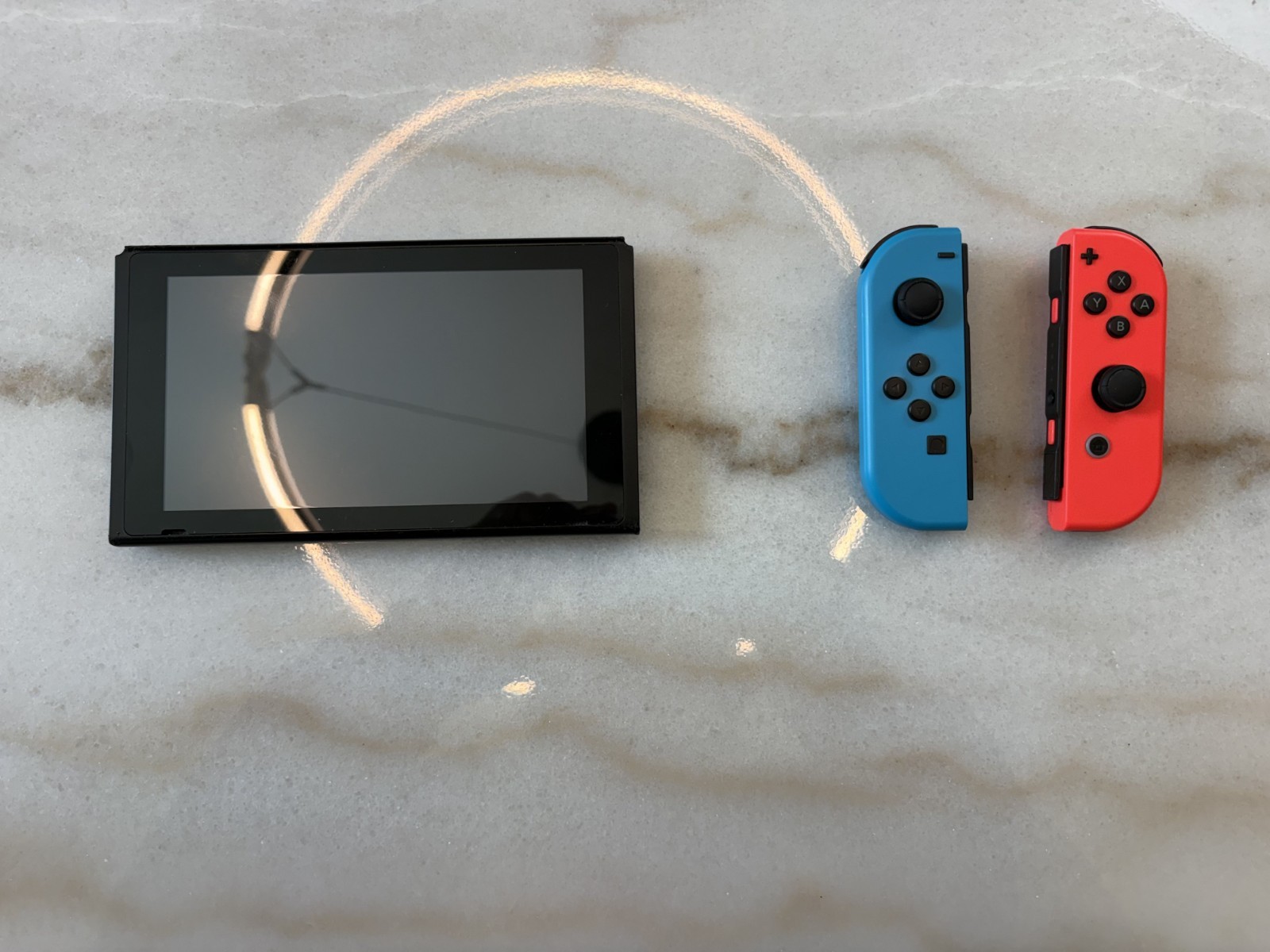 Nintendo Switch 32GB Console with Neon Red and Blue Joy-Cons and A controller