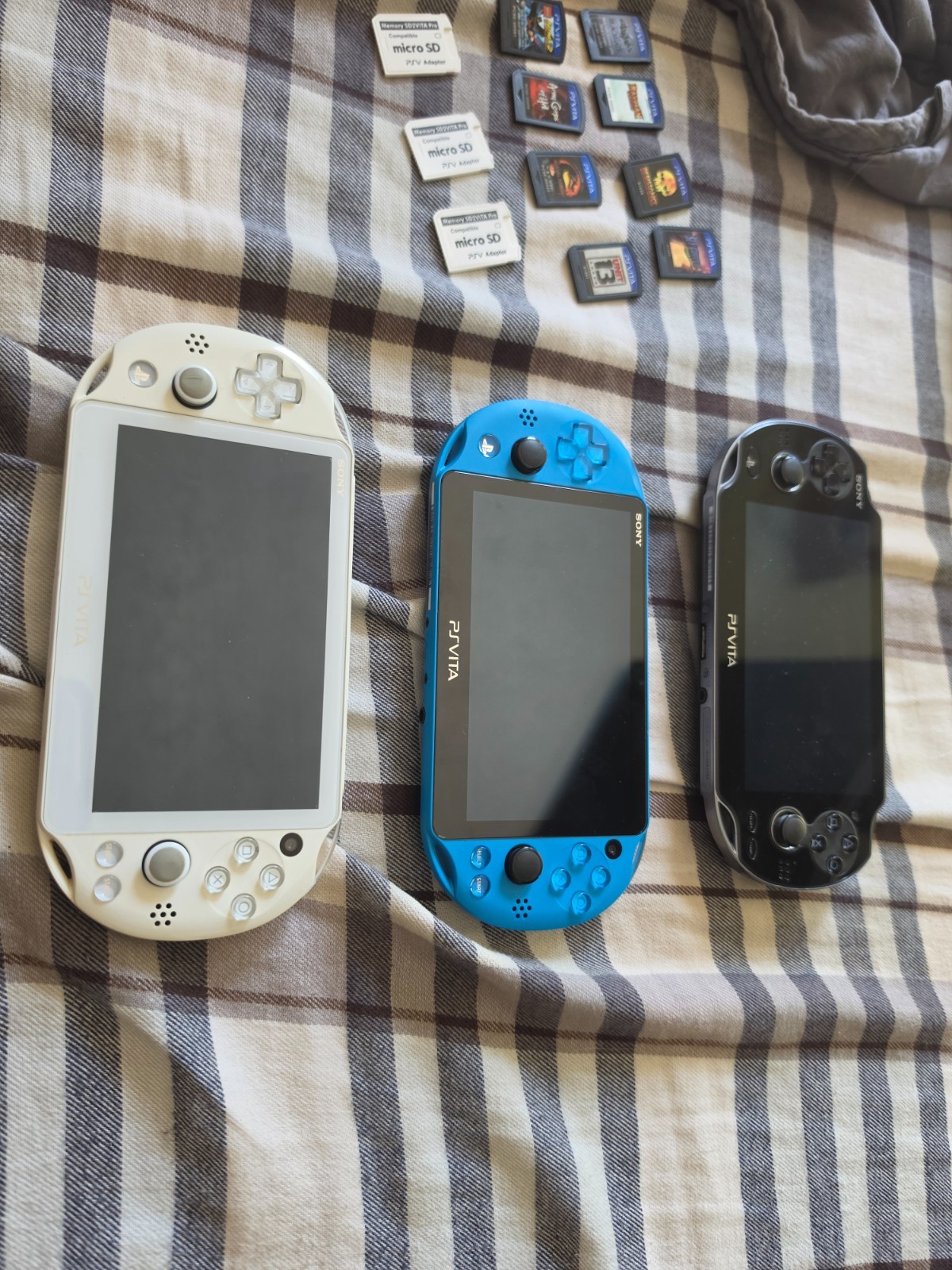 Sony Vita lot Glacier White 2000 series, jet blue 2000 series, black 1000 series