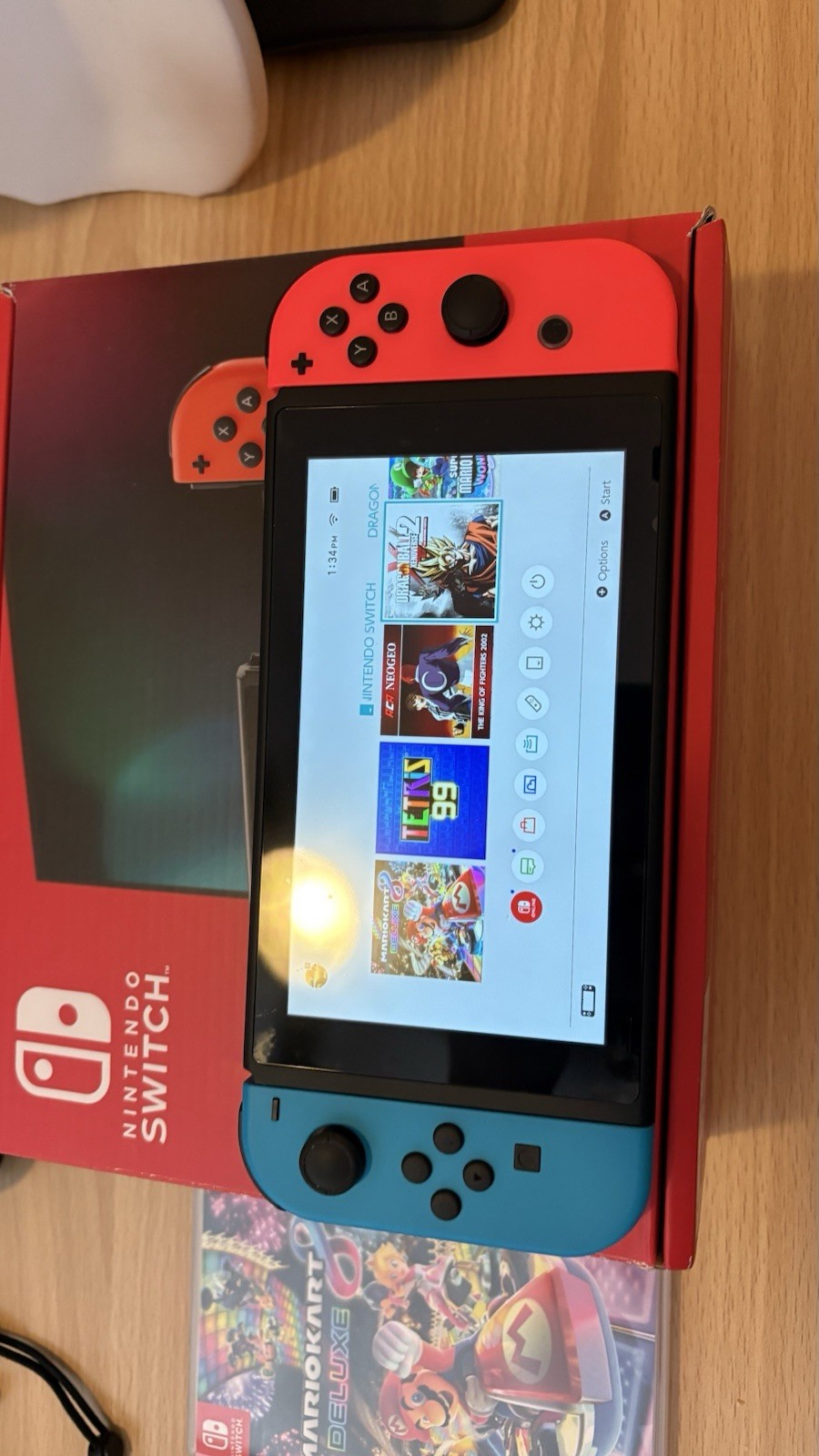 Nintendo Switch with Blue and Red Joy-Con Controllers and Mario Kart 8 – Black
