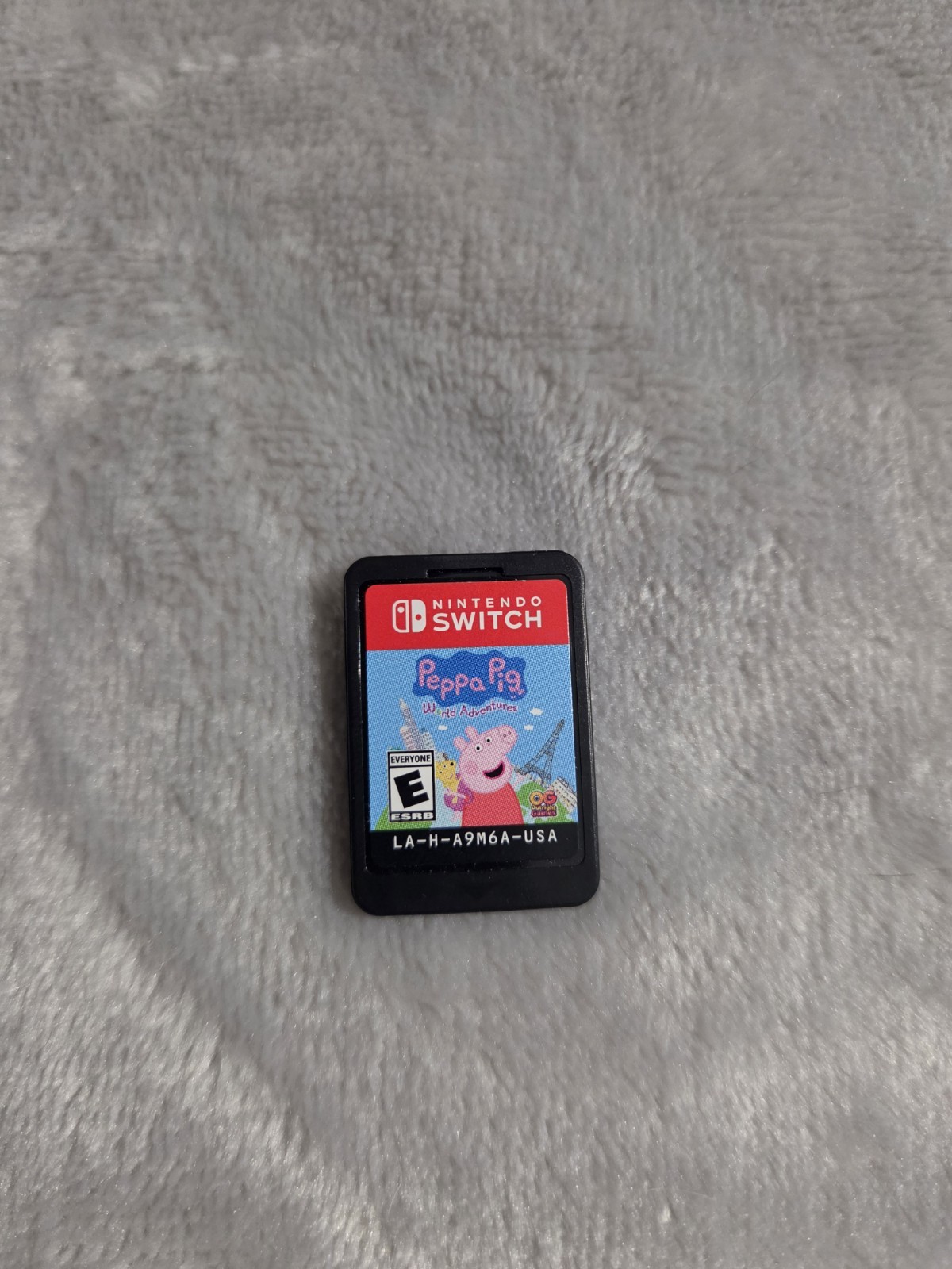 Nintendo Switch Lite Coral with Bratz, Monster High, & Peppa Pig Games, Charger