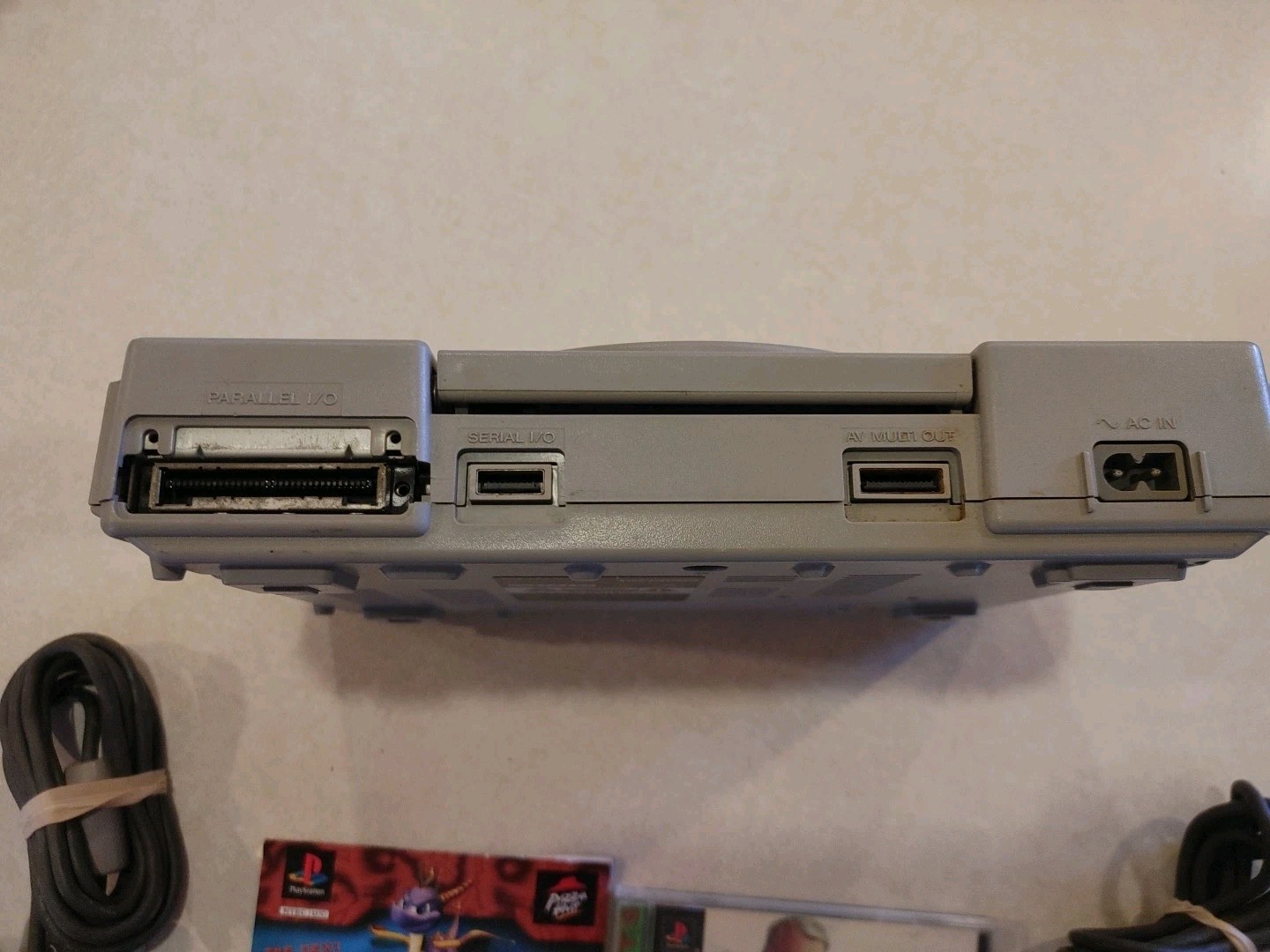 Sony PlayStation Console with two controllers and games