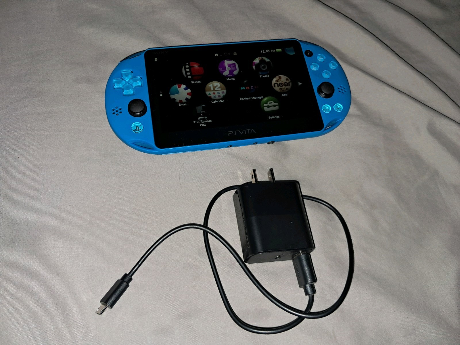 Sony PS Vita PCH-2000 Blue Handheld System Console Wi-Fi with charger and sd
