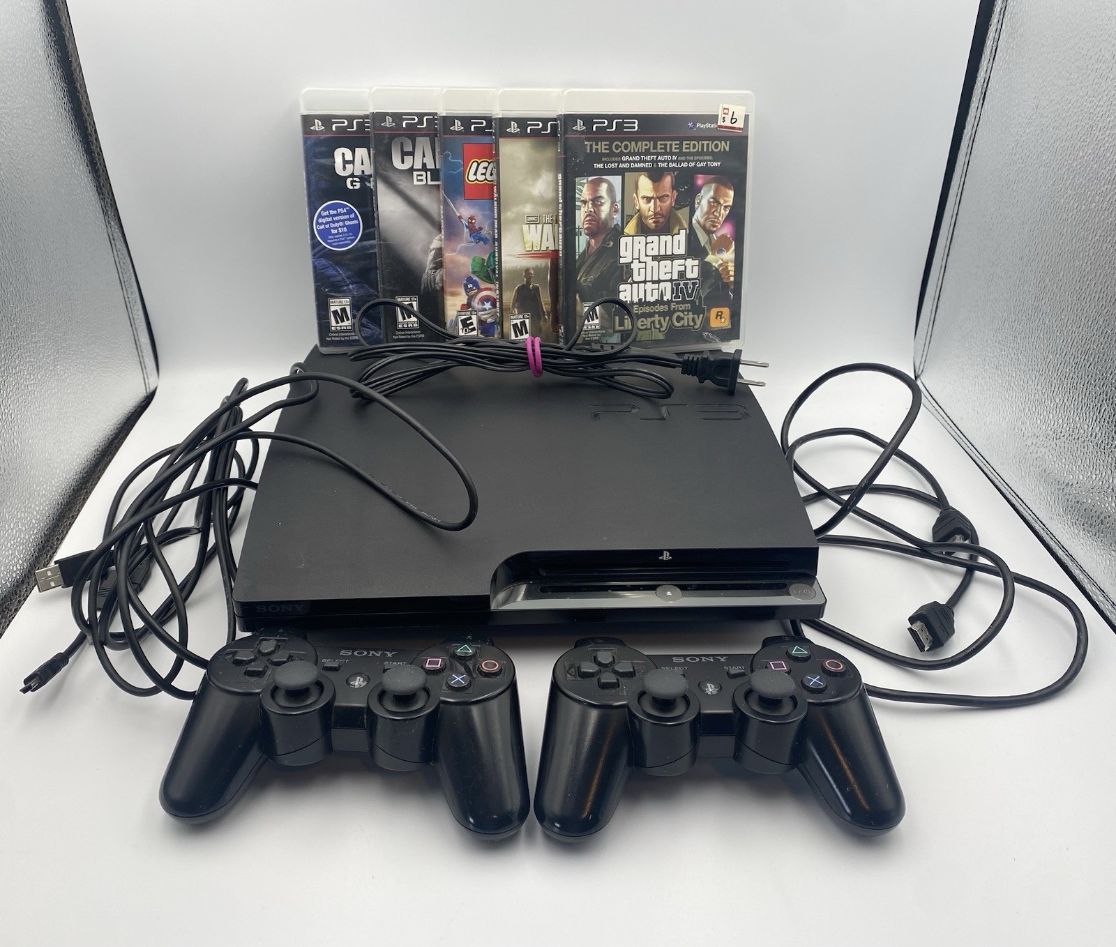 PS3 Sony PlayStation 3 CECH-2501A Console 2 Controller Cables & 5 Games Works