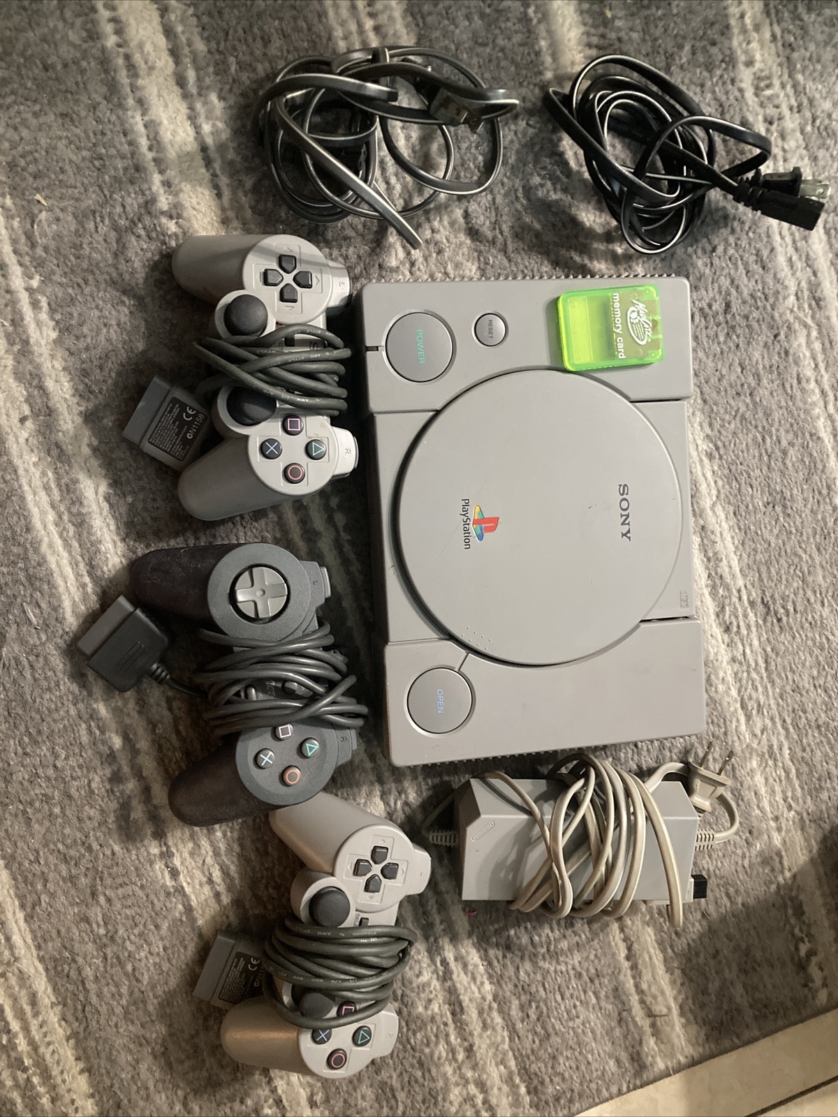 Sony PlayStation 1 Console With Three Controllers & Play Station With Cords.